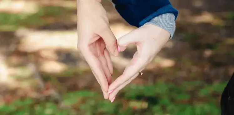 Hands making a love heart symbol - Free Quit Smoking Coach