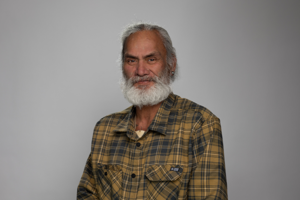 Portrait of Paora Stanley against a neutral background.