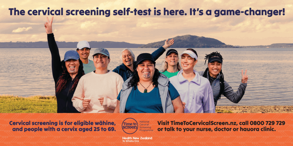 Cervical Screening Group of smiling people of different ages and backgrounds standing by a lake, holding up peace signs. Promotional banner text reads: “The cervical screening self-test is here. It’s a game-changer!”